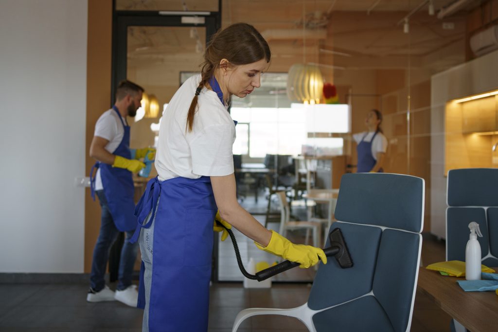 Cleaning team working together in an office
